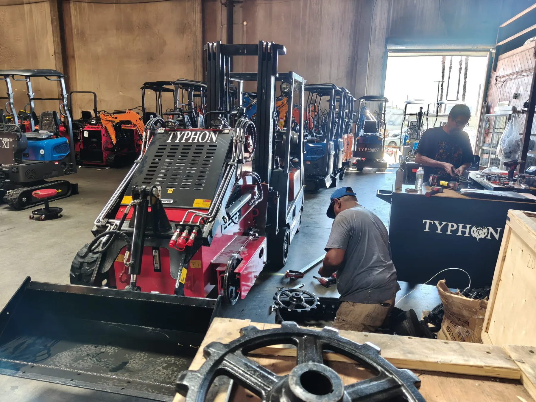 Heavy duty machinery warehouse with mini excavators aligned and prepped